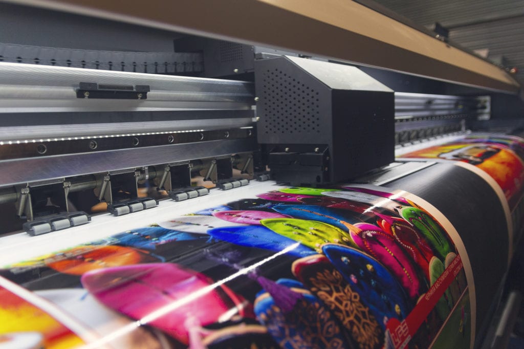 Large format printing machine in operation. Industry